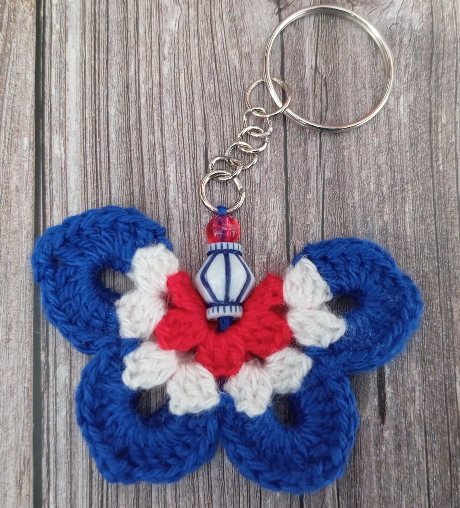 Porte clé papillon bleu/blanc/rouge