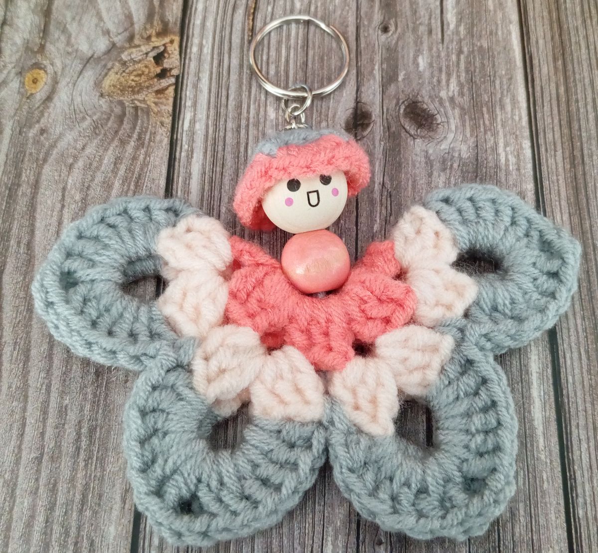 Porte clé papillon gris/rose/saumon