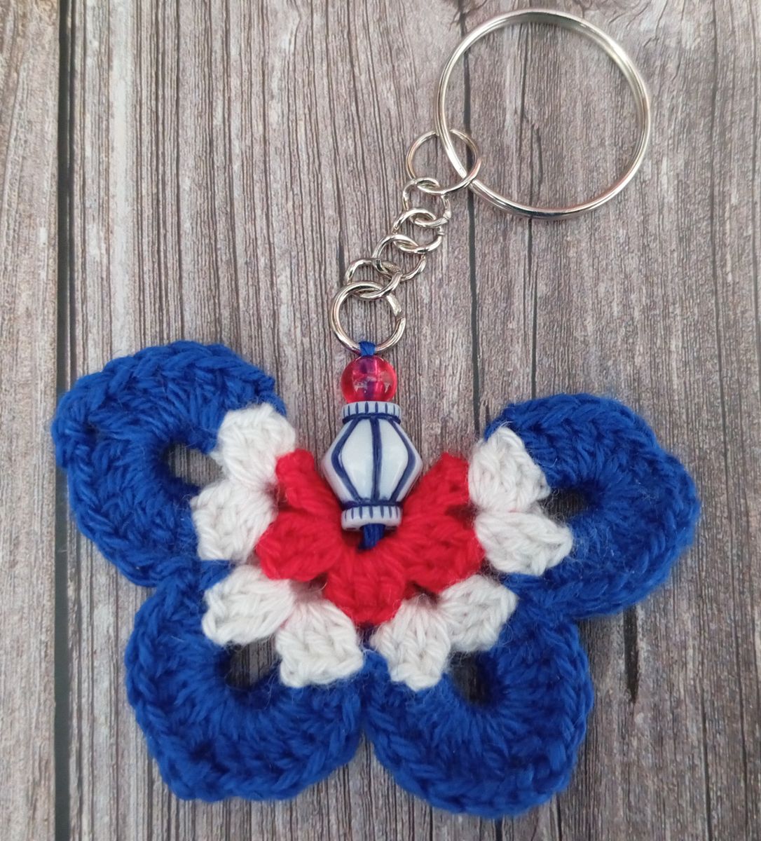 Porte clé papillon bleu/blanc/rouge