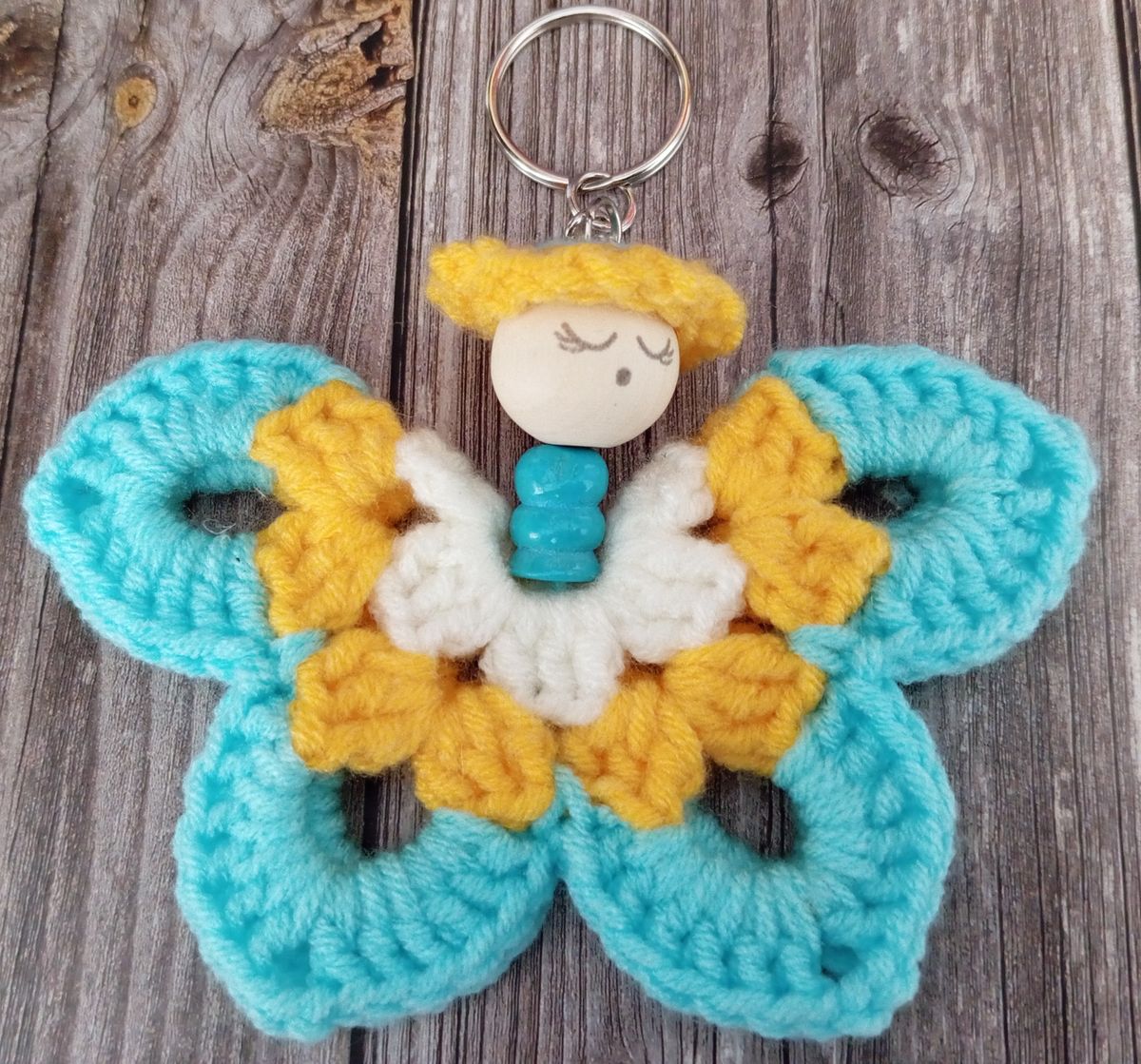 Porte clé papillon bleu/jaune/blanc