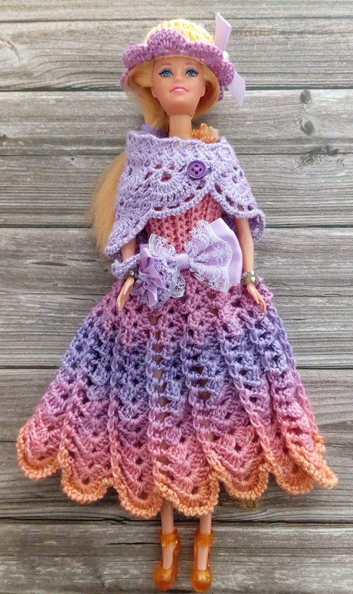 Robe rose/mauve pour poupée type Barbie